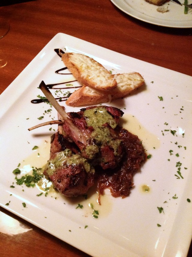 Mediterranean herb crusted lamb rack, caramelized scallions and basil sauce with Pecorino crostini
