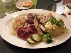 Blood sausage, liver sausage, braised pork belly and pork tongue with savoury mashed potatoes and slaw, Leipzig