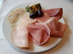 Plate of mixed sausage and ham breakfast, Ramada, Berlin