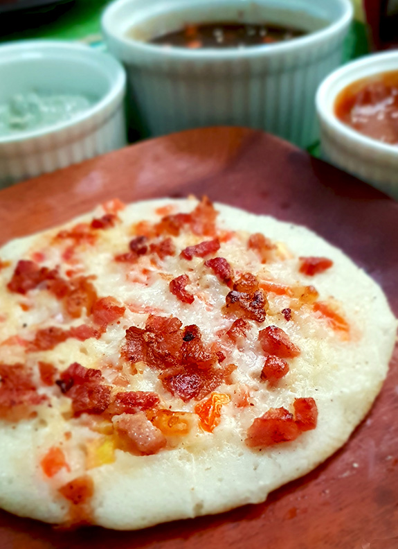 Bacon dosa with miso sauce, blue cheese dip and curry leaf barbecue sauce